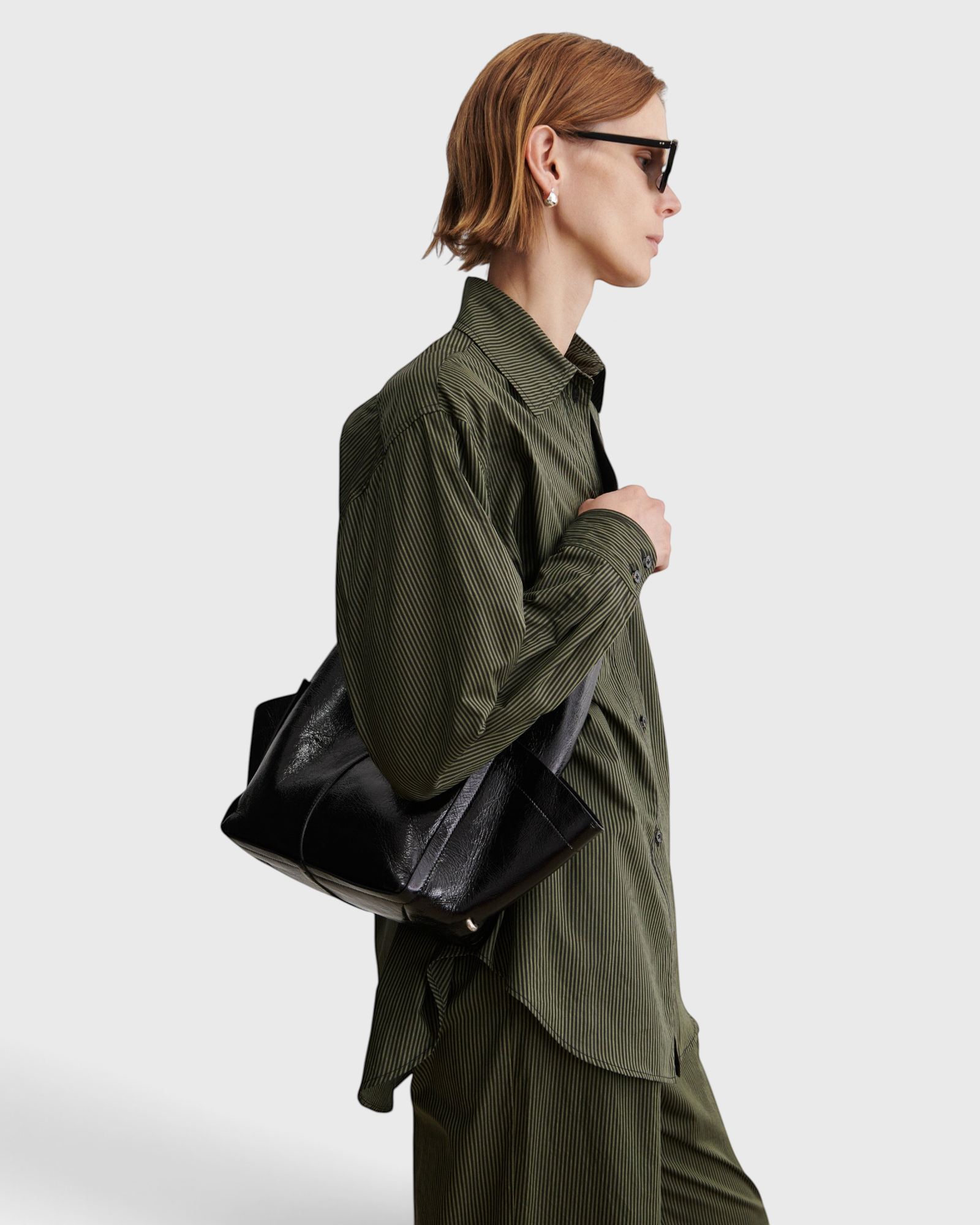 RACHEL COMEY Tool Bag in black leather, interior view with magnetic closure.