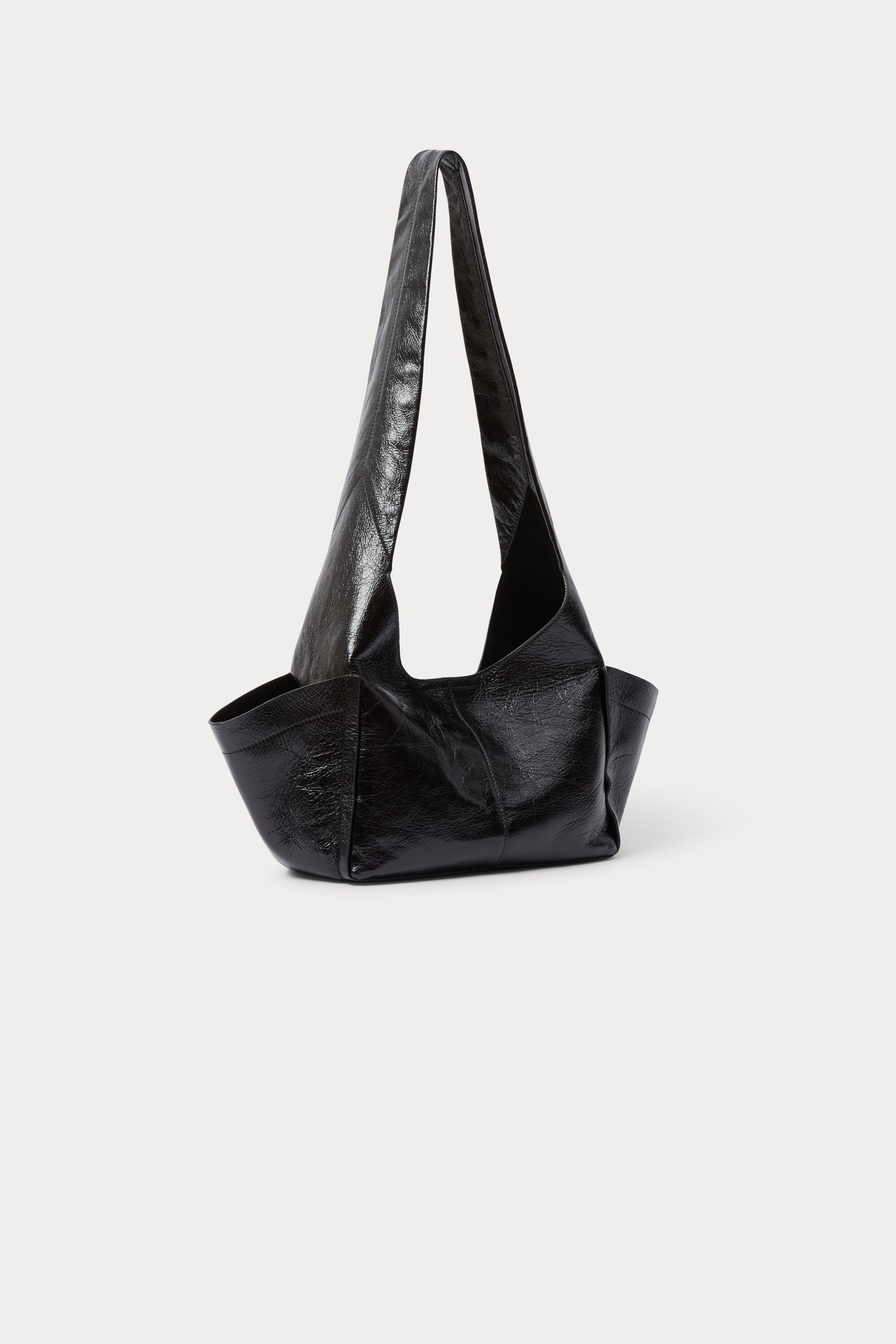 Model wearing the RACHEL COMEY Tool Bag in black leather, styled look.