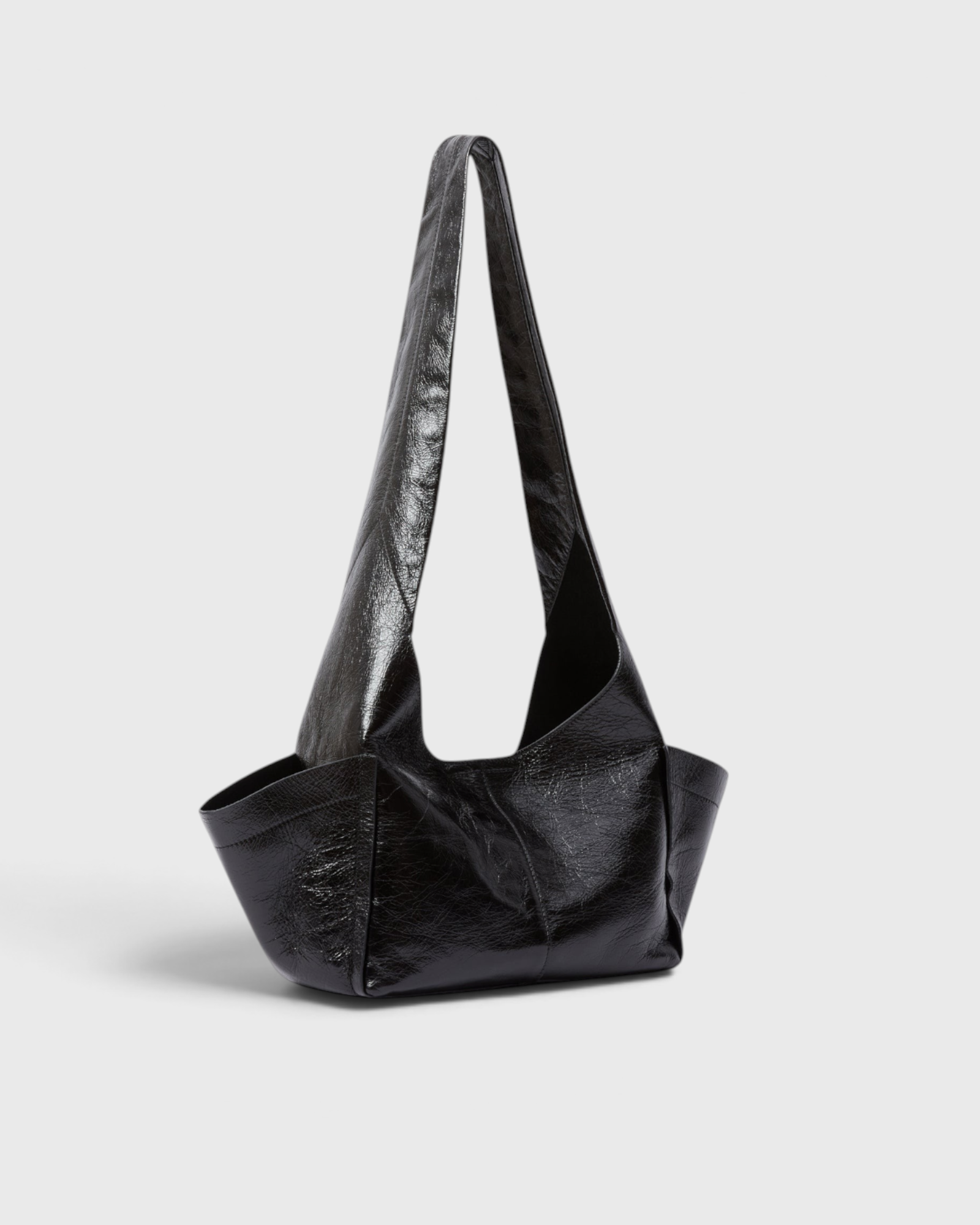 Model wearing the RACHEL COMEY Tool Bag in black leather, styled look.