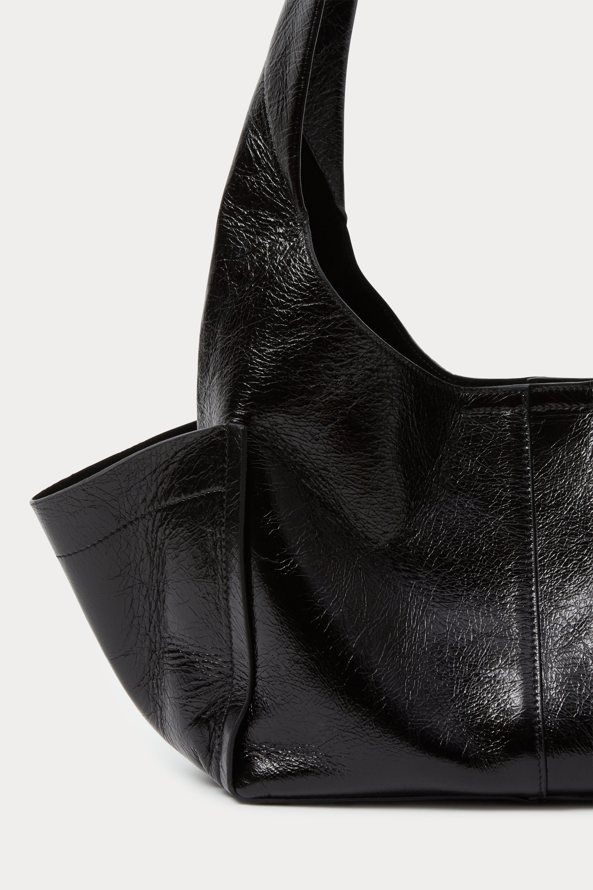 Model carrying the RACHEL COMEY Tool Bag in black leather across the body.