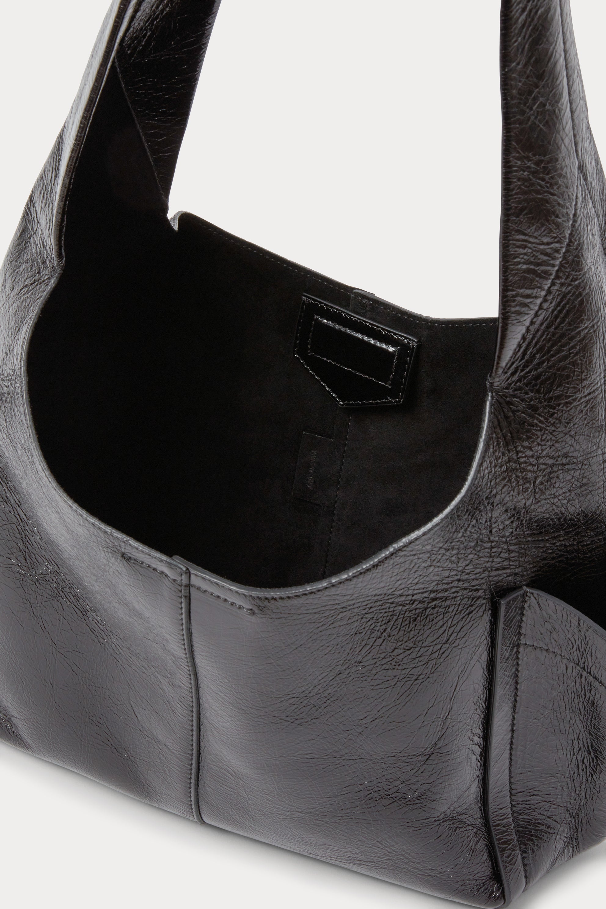 RACHEL COMEY Tool Bag in black leather, detail of strap and stitching.