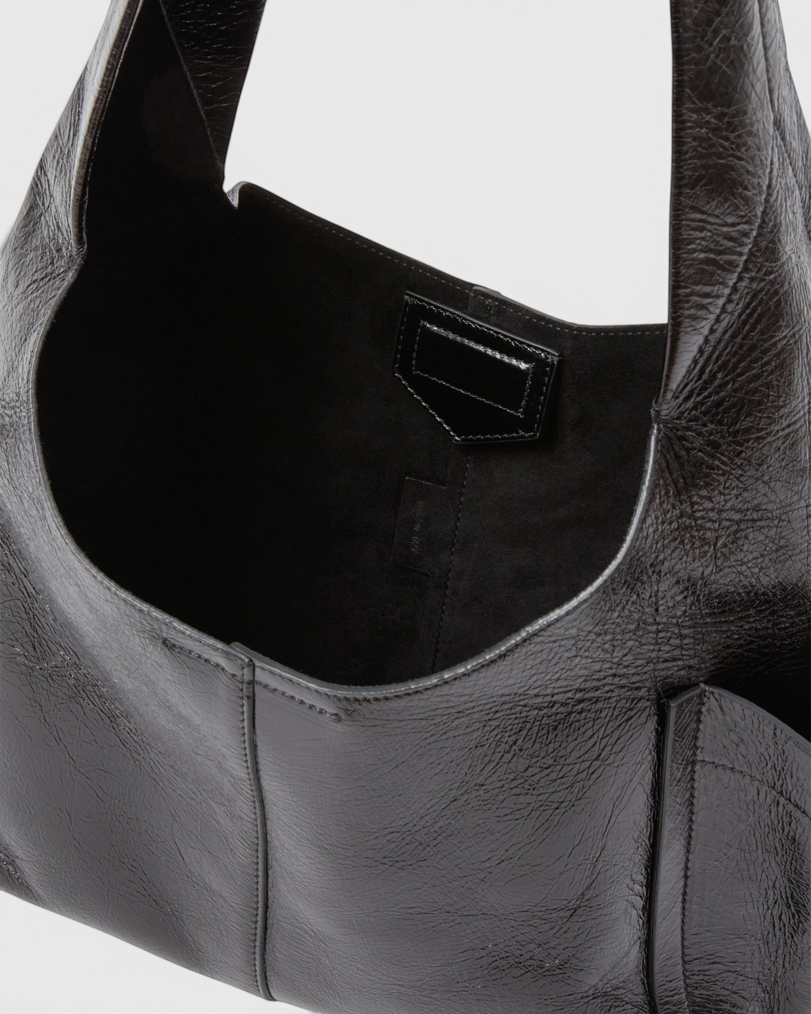 RACHEL COMEY Tool Bag in black leather, detail of strap and stitching.
