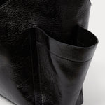 RACHEL COMEY Tool Bag in black leather, detail of crinkled lustre finish.