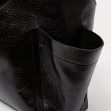 RACHEL COMEY Tool Bag in black leather, detail of crinkled lustre finish.