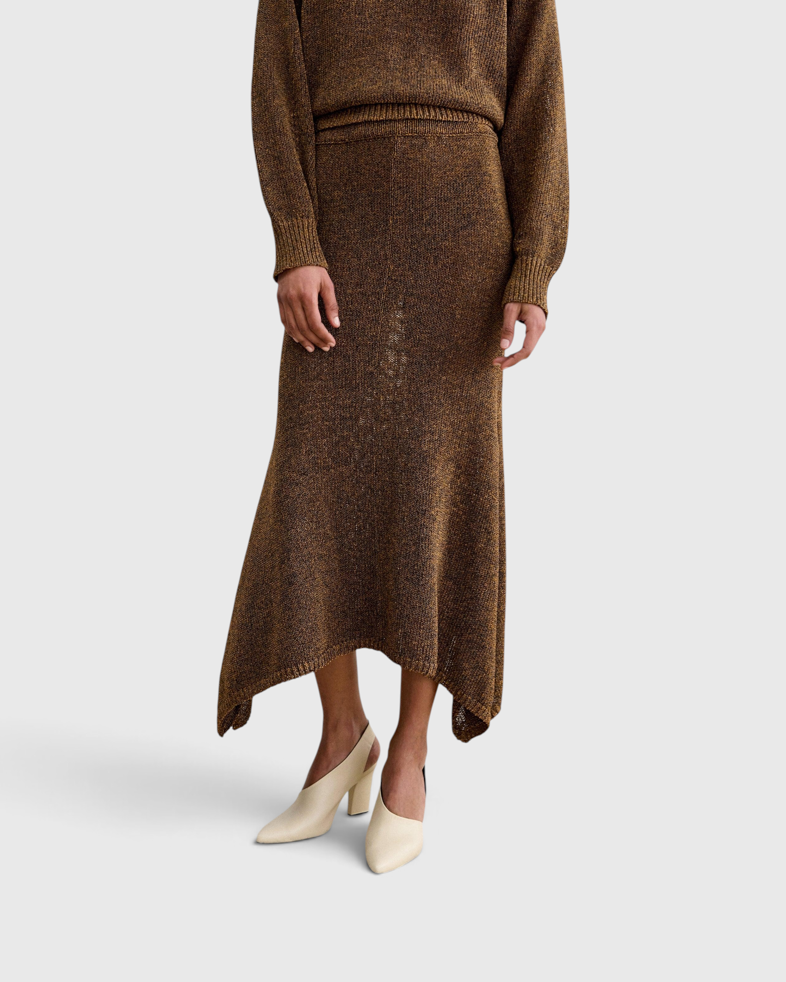 Rachel Comey Lenco Skirt in Brown, close-up front view showing handkerchief hem and waistband