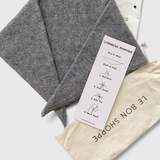 JONES + CO grey cashmere and wool blend bandana scarf with instructional card and cotton storage pouch