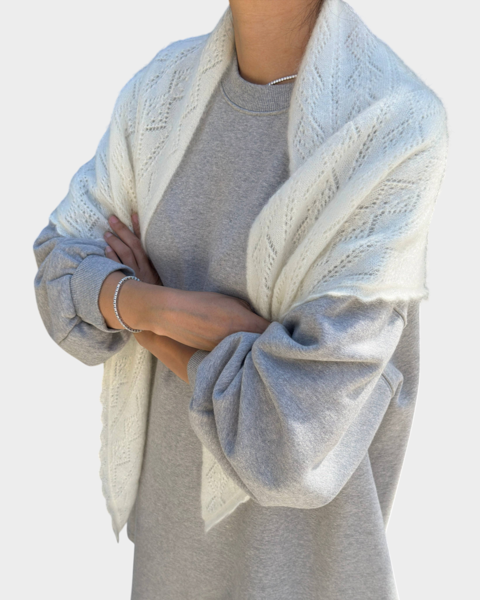 JONES + CO pearl white mohair pointelle shawl with delicate scalloped edges draped over a grey sweatshirt