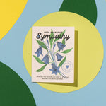 Sympathy card with floral design on a colorful geometric background