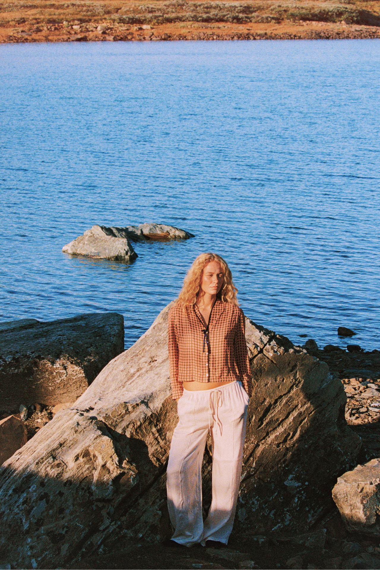 Trovata Lottie Blouse in Vintage Parlor — styled outdoors with wide-leg pants