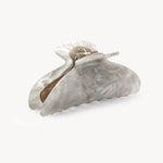 Marble-patterned hair clip on a white background