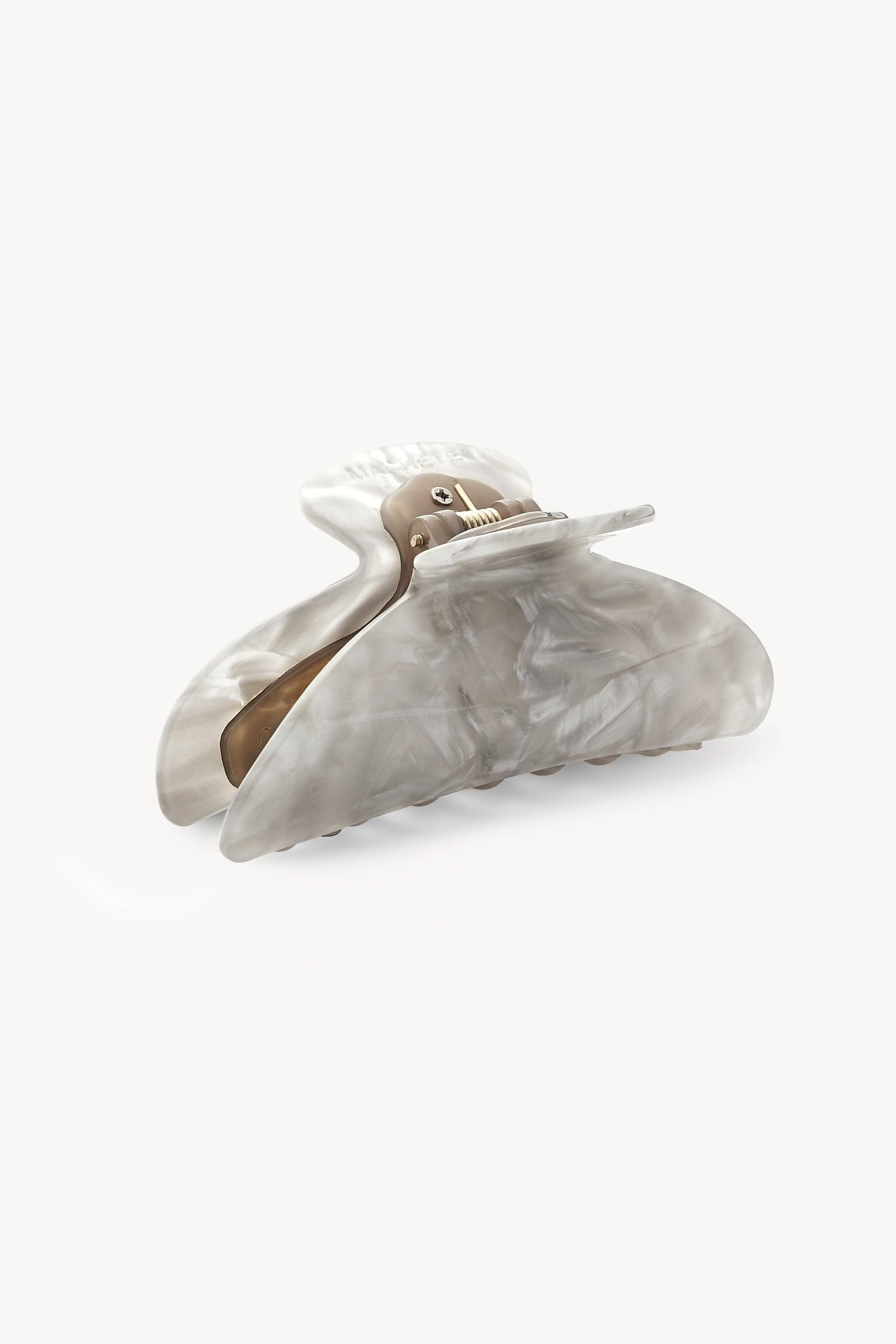 Marble-patterned hair clip on a white background
