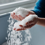 hands holding sea salt flakes 