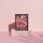 Greeting card with pink dragon design and 'Stay Fierce' text on a pink background