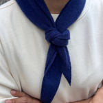 JONES + CO navy blue cashmere and wool blend bandana scarf tied in a simple knot around the neck