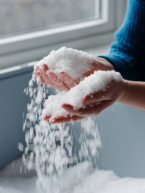hands holding the flakey norweigan sea salt