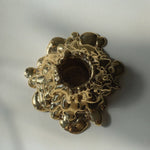 Gold decorative object on a white background