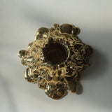 Gold decorative object on a white background