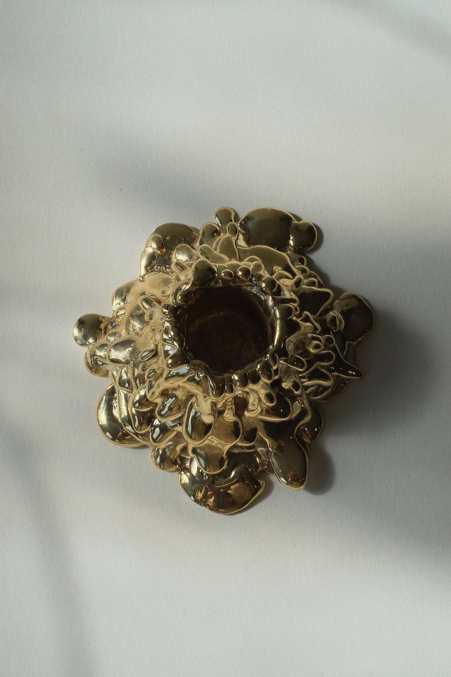 Gold decorative object on a white background