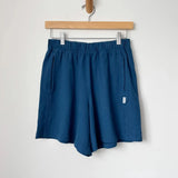 Flared Basketball Shorts - Ocean hanging on wall 