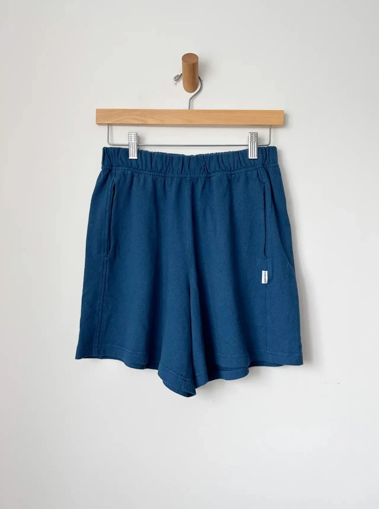 Flared Basketball Shorts - Ocean hanging on wall 