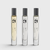 JONES + CO natural perfume oil rollers in three distinct scents with glass bottles and black caps.