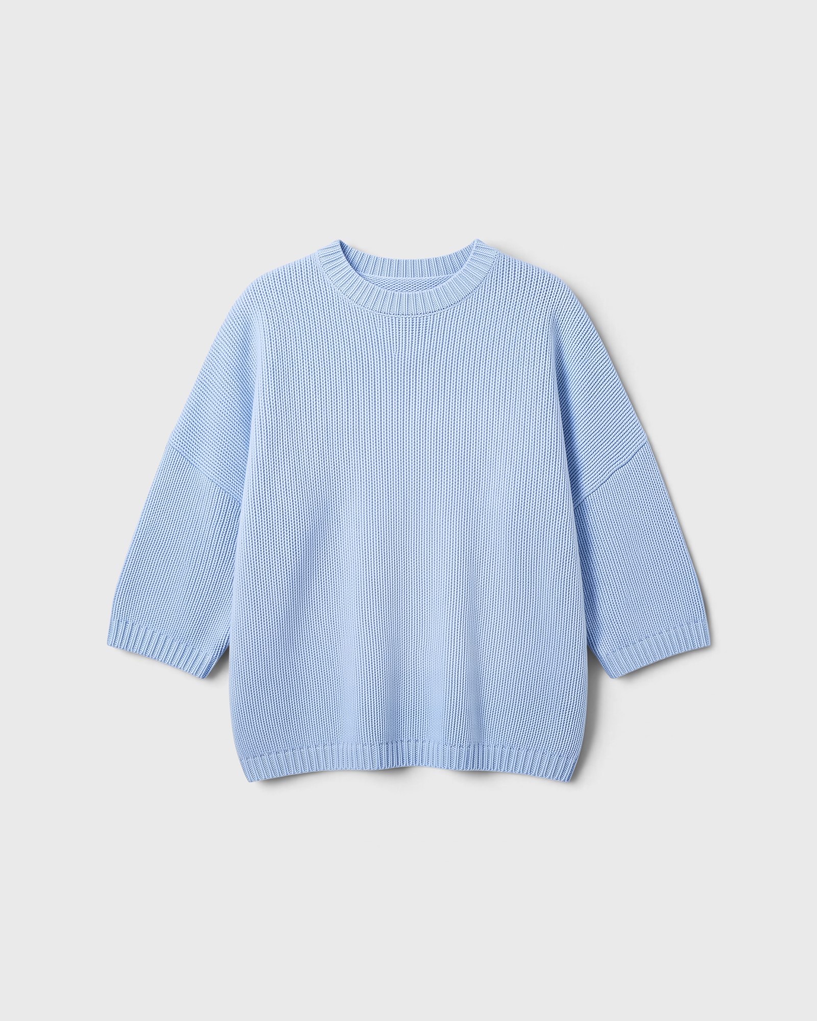 JONES + CO oversized crew-neck sweater in heathered blue with dropped shoulders and short sleeves.