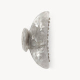 Grey shell style claw clip on a white background. 