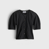 JONES + CO black Noor button-front top in cotton-viscose with short puff sleeves and metallic thread detail.