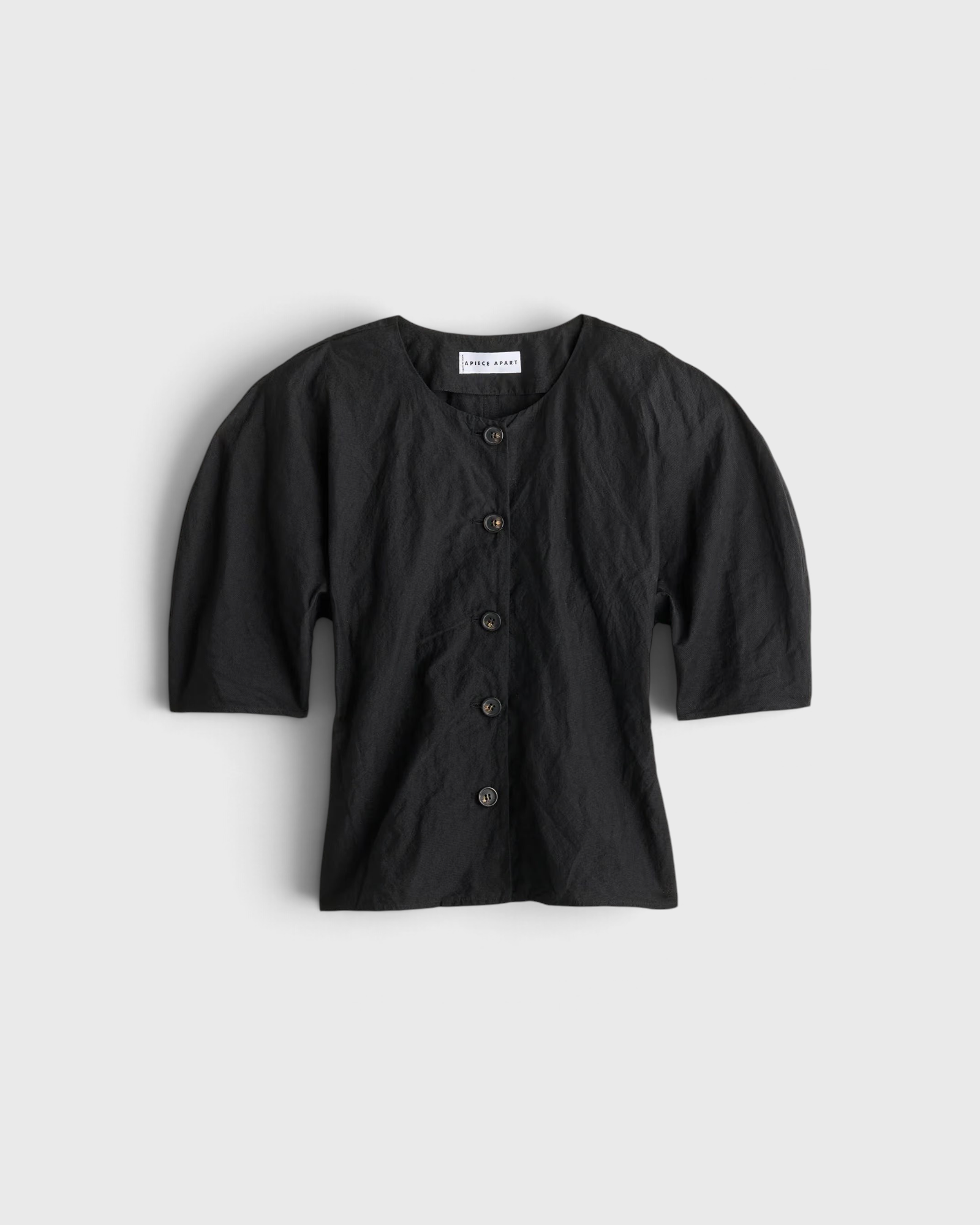 JONES + CO black Noor button-front top in cotton-viscose with short puff sleeves and metallic thread detail.
