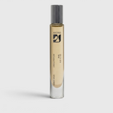 JONES + CO Amber Solis natural perfume oil roll-on in a sleek glass bottle with a metallic cap on a white background.