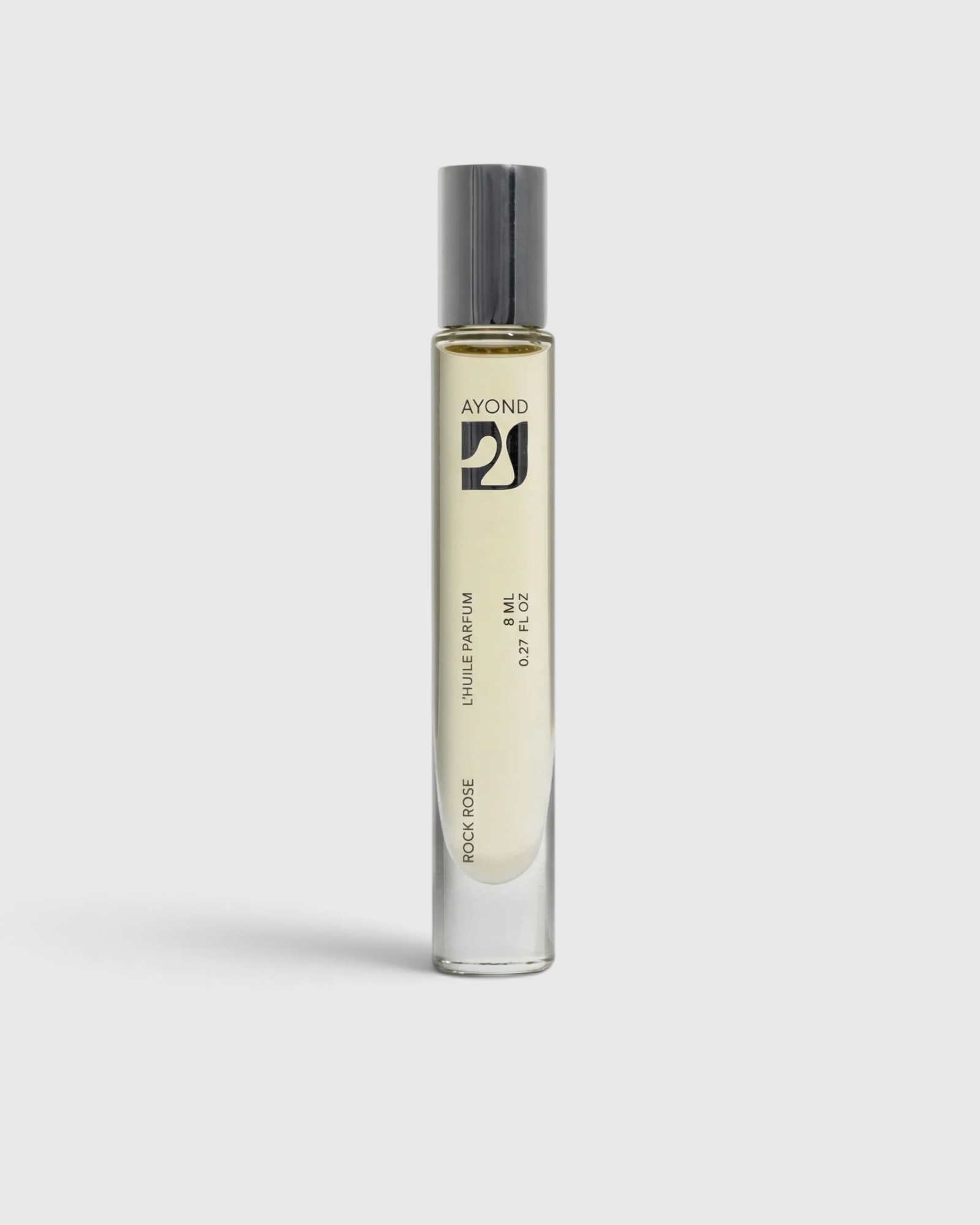 JONES + CO Rock Rose natural perfume oil roller in a sleek glass bottle with a silver cap on a white background