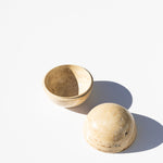 stone cylinder box, open against white background