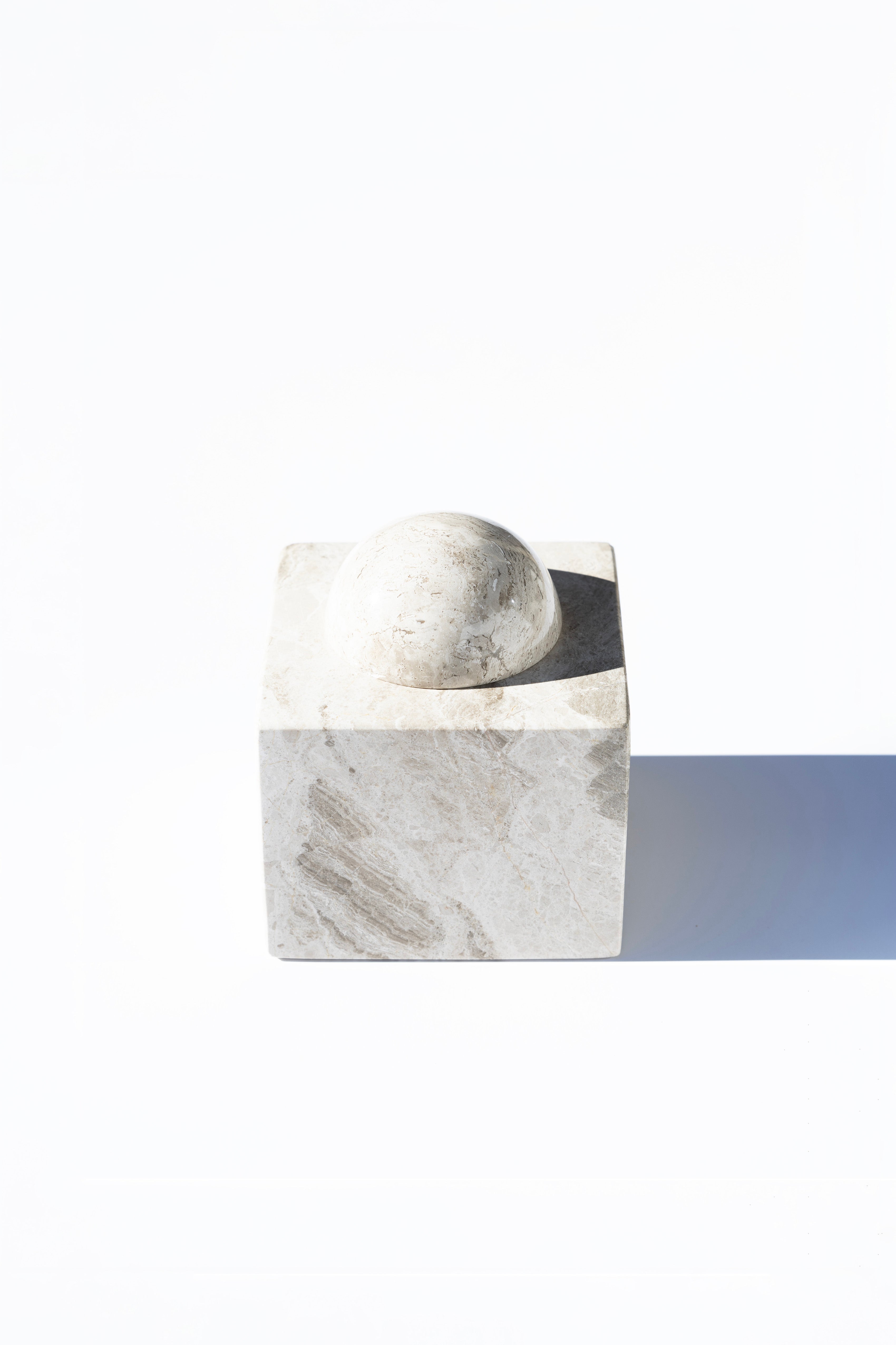 stone box with ball lid, white background