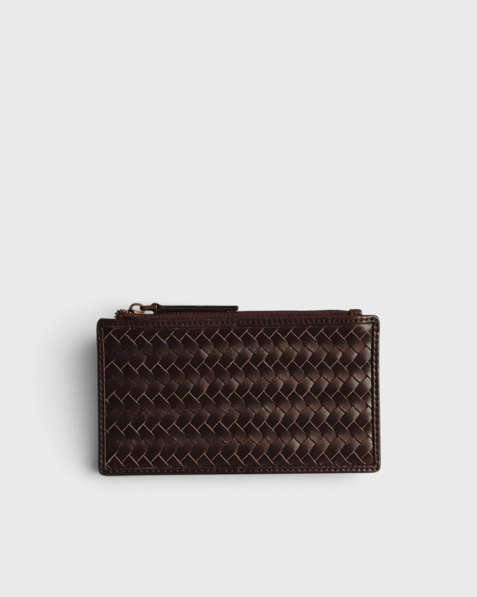 JONES + CO Odin espresso brown woven leather card case with a zip pouch and slim minimalist design.