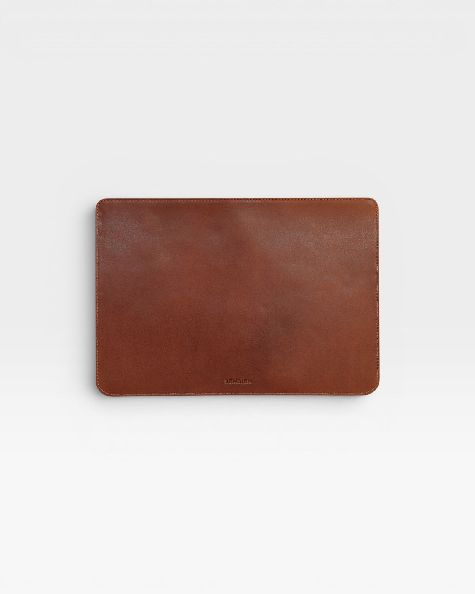 Brown leather laptop sleeve on a white background