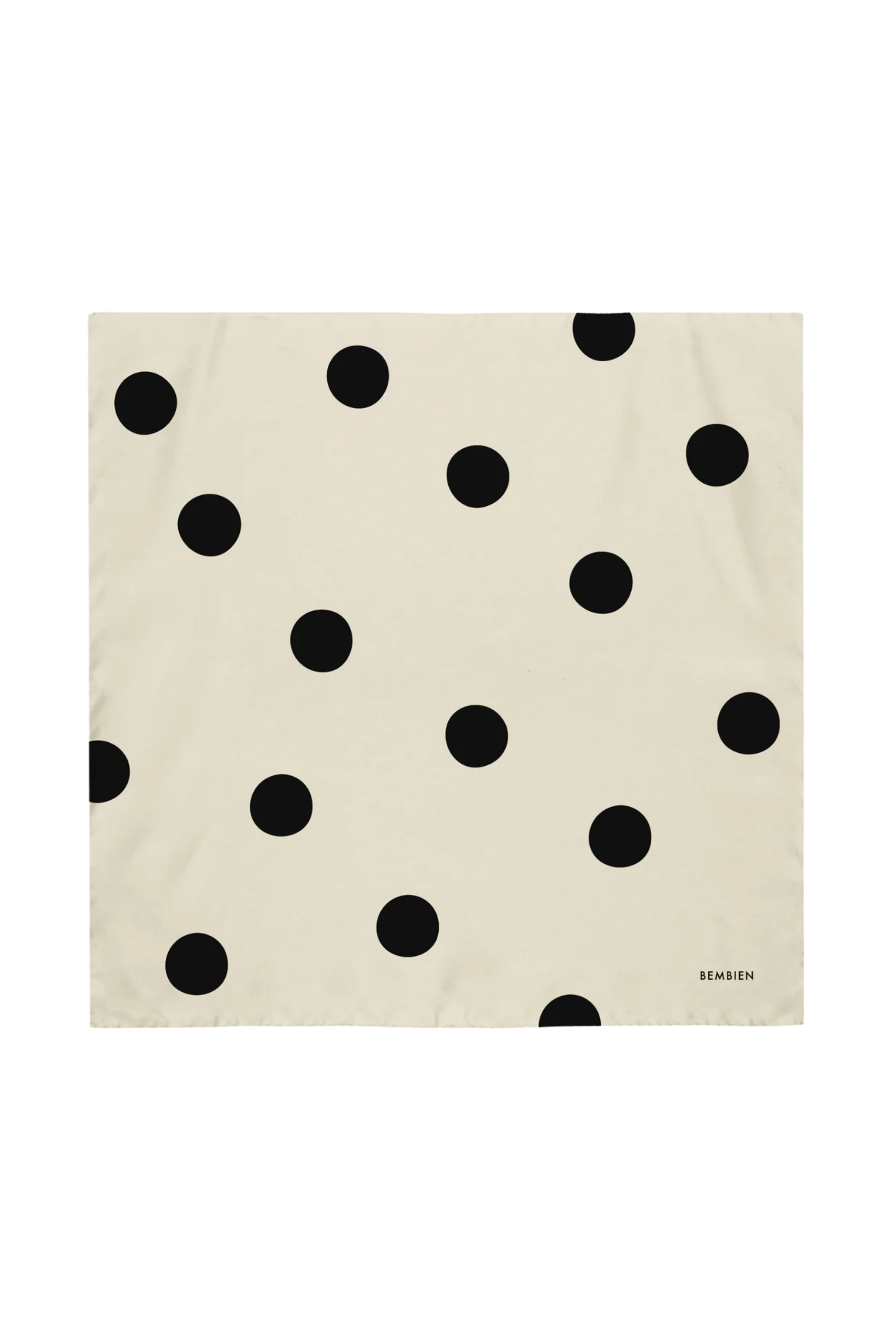 Beige fabric with black polka dot pattern on a white background