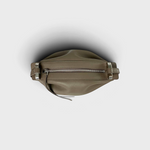 JONES + CO Bon-Bon taupe leather handbag featuring a pleated design and silver metal clasp detail from a top view.