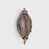 JONES + CO Bon-Bon Cords bag in shiny taupe Italian leather with pleated ends and a metal clasp closure.