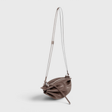 JONES + CO Bon-Bon Cords bag in shiny taupe Italian leather with a pleated design and double leather cord strap.