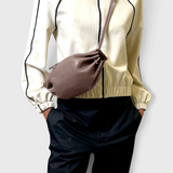 JONES + CO Bon-Bon Cords bag in shiny taupe Italian leather with a pleated design and double leather cord strap.