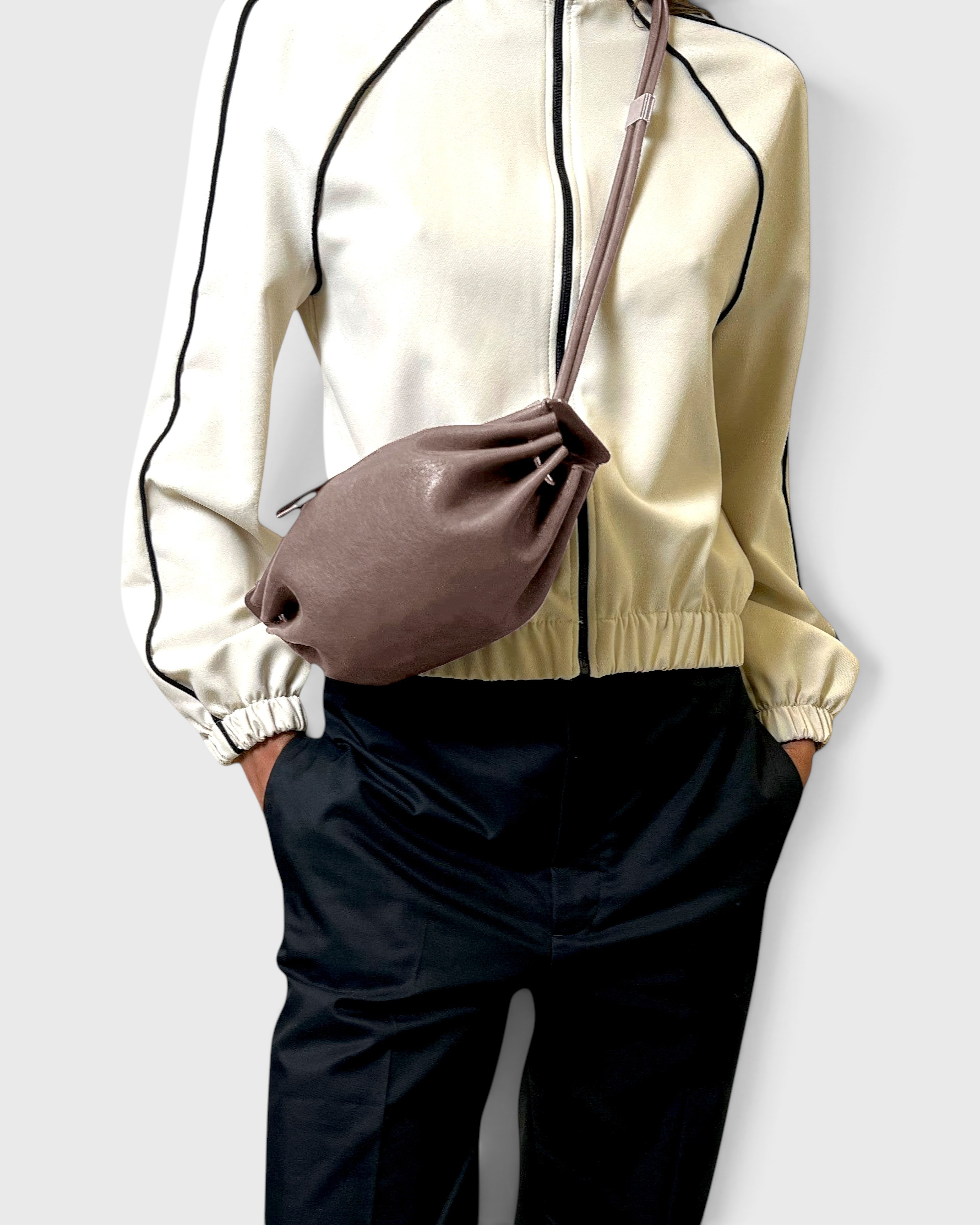 JONES + CO Bon-Bon Cords bag in shiny taupe Italian leather with a pleated design and double leather cord strap.