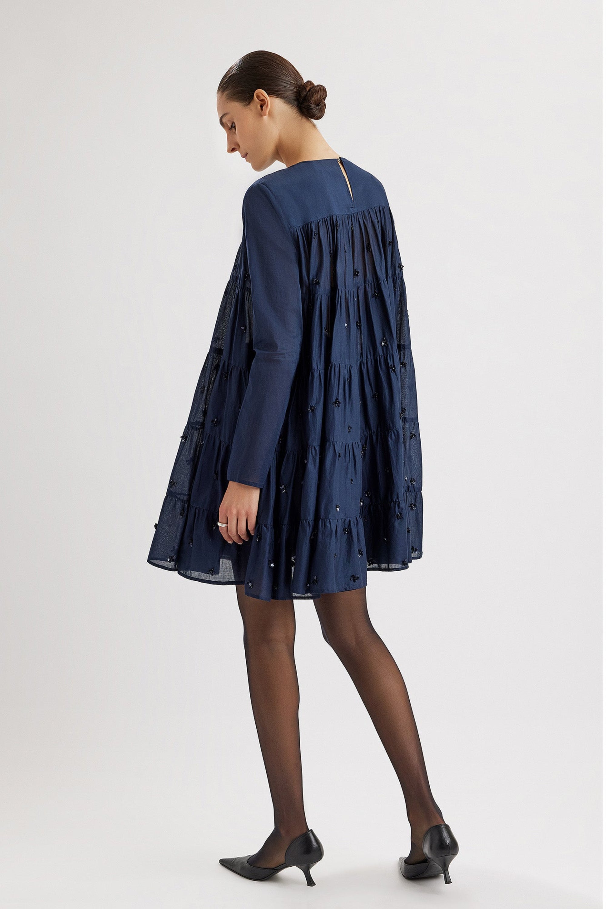 Merlette Soliman Embellished Dress in Navy - back view showing the smocked yoke and tiers