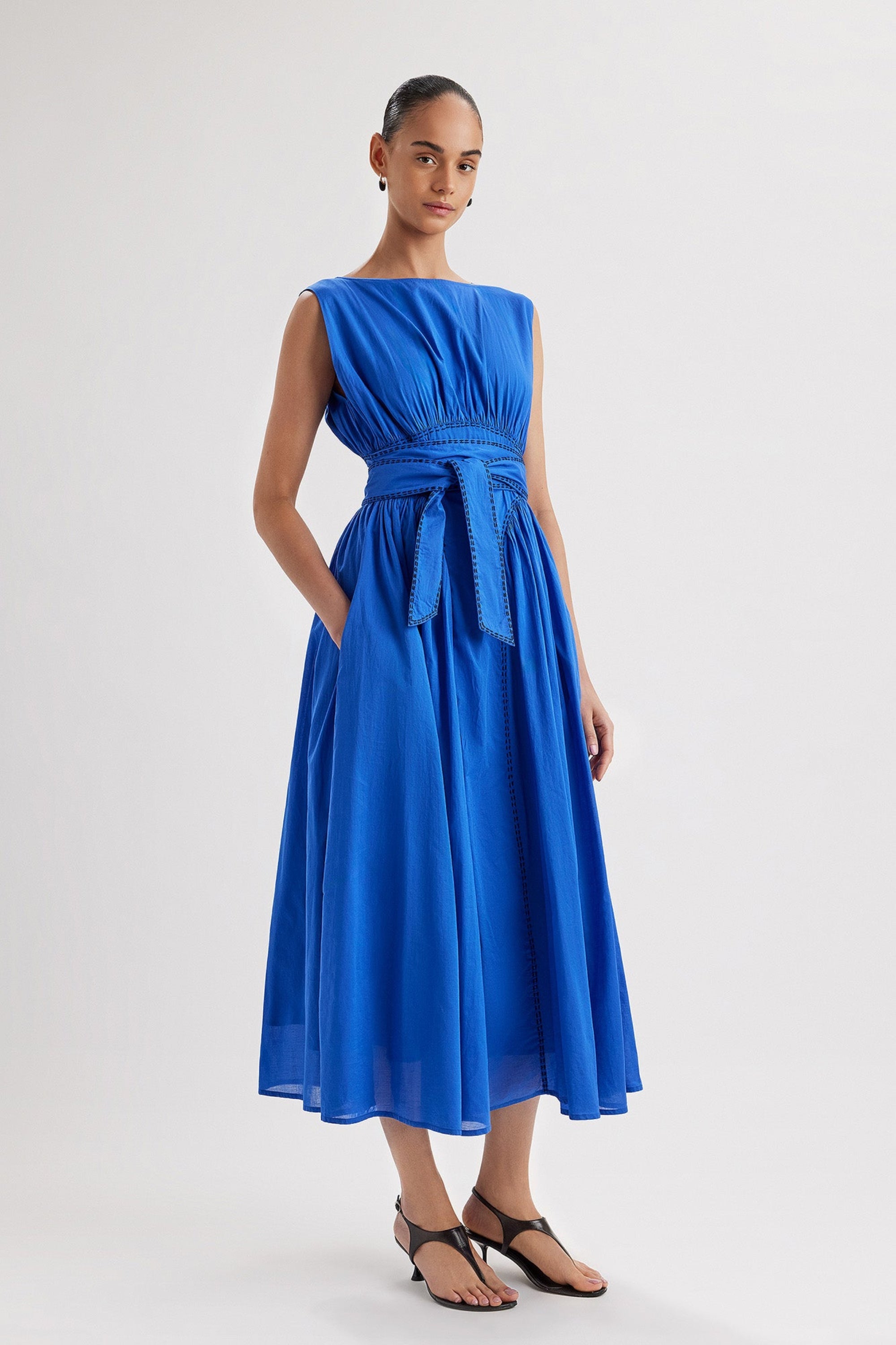 Merlette Verena Dress in Ultramarine — full-length front view worn with the waist ties knotted at the front