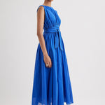 Merlette Verena Dress in Ultramarine - three-quarter view showing the skirt volume and drape