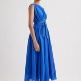 Merlette Verena Dress in Ultramarine - three-quarter view showing the skirt volume and drape