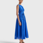 Merlette Verena Dress in Ultramarine - three-quarter view showing the skirt volume and drape