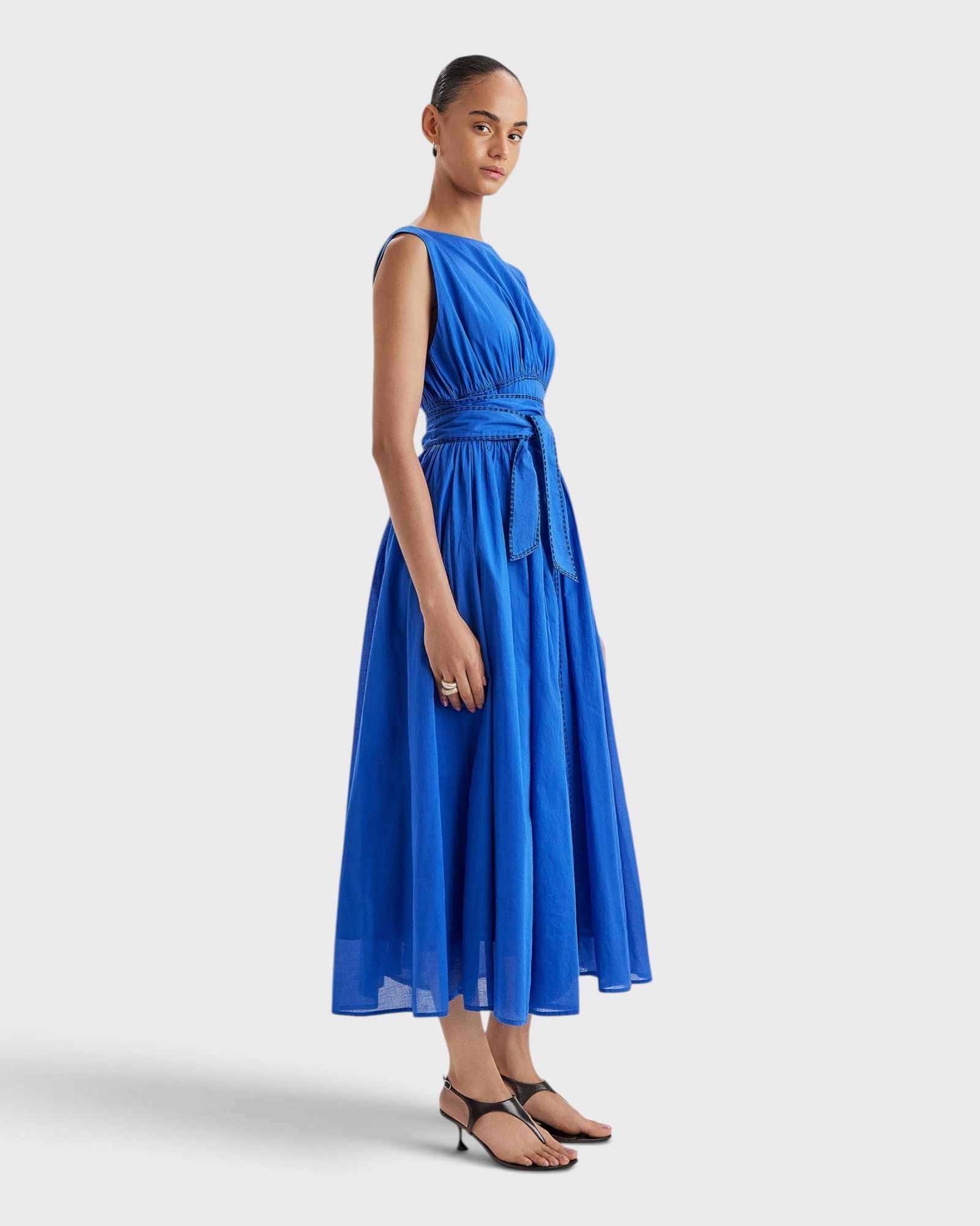 Merlette Verena Dress in Ultramarine - three-quarter view showing the skirt volume and drape