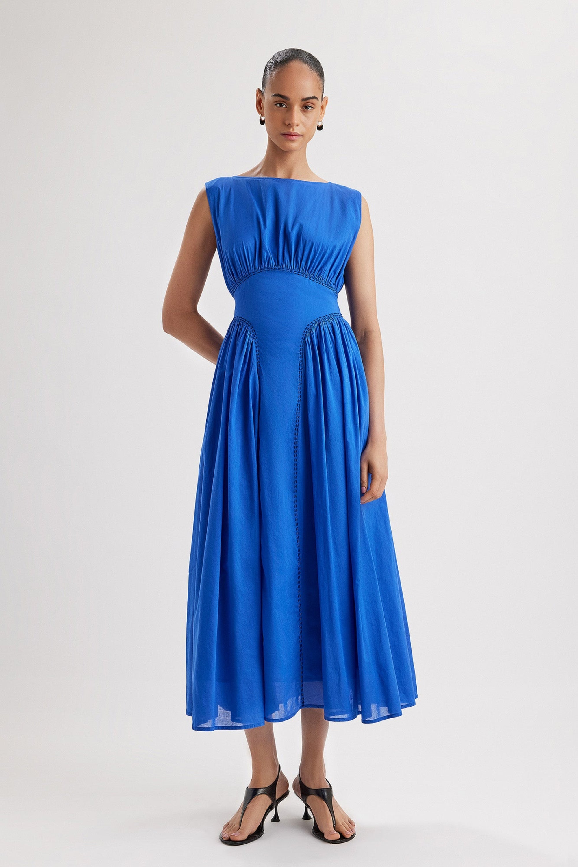 Merlette Verena Dress in Ultramarine — full-length front view with the ties fastened at the back, showing the fitted waist panel