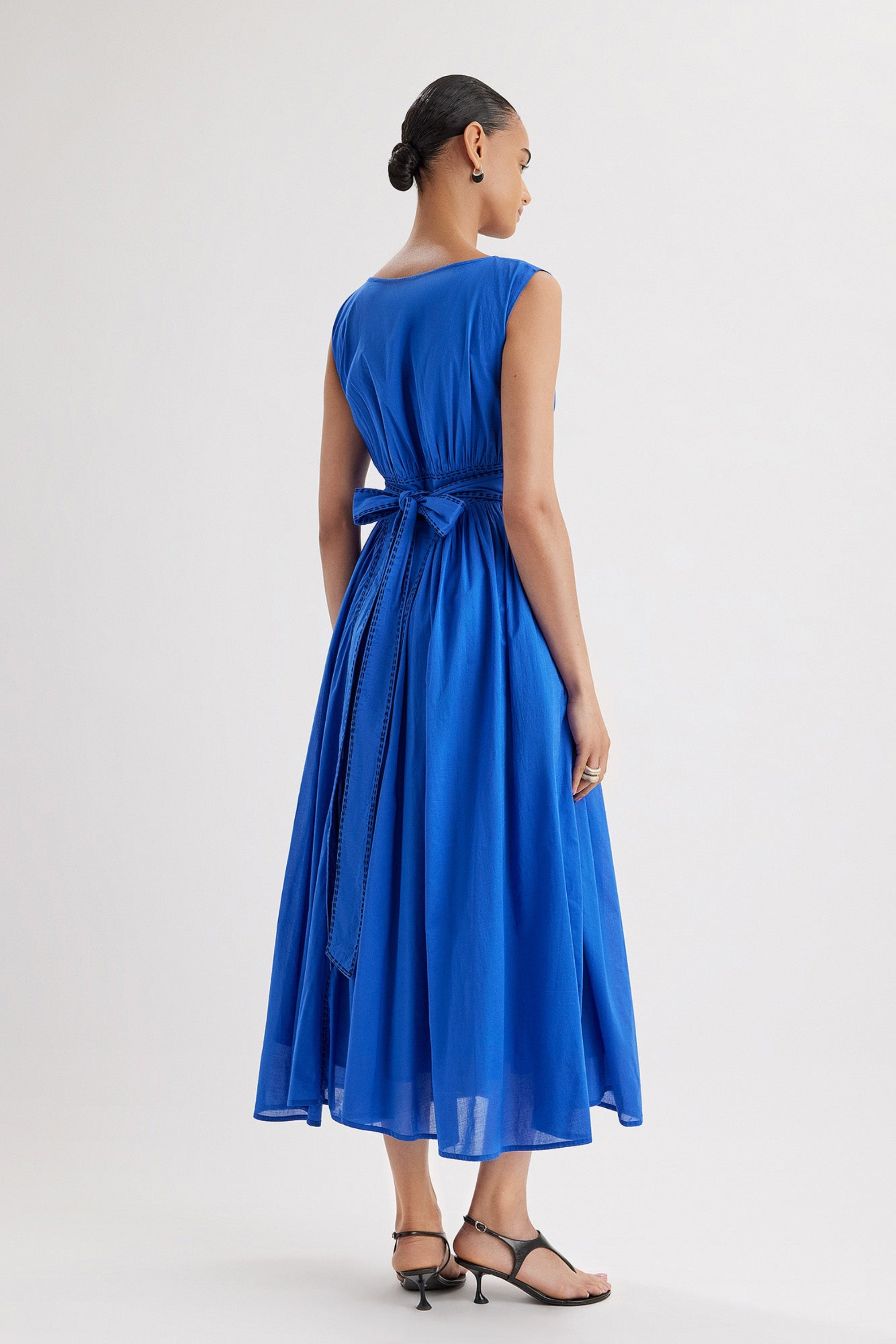 Merlette Verena Dress in Ultramarine — back view showing the waist ties and gathered skirt