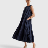 Merlette Caron Dress in Navy - side view showing the drape and side seam pocket